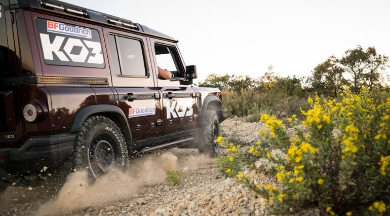 Ineos Grenadier driving quickly on a gravel track
