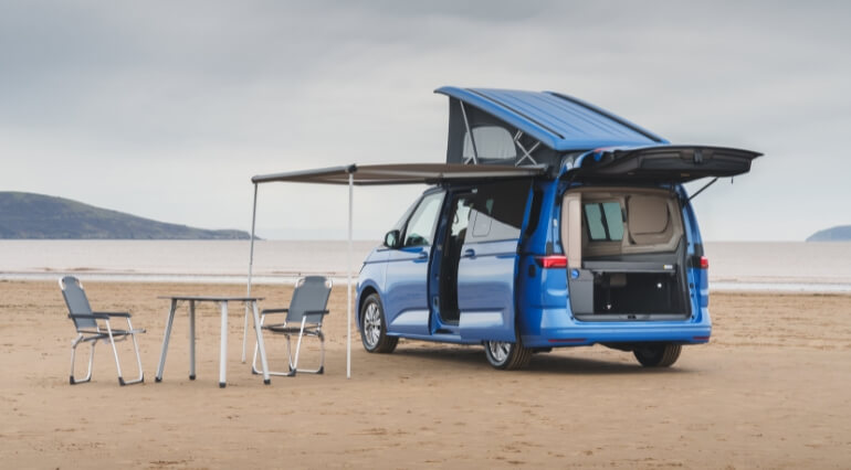 VW California camping on beach