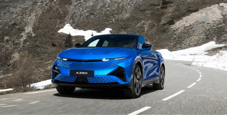 Alpine A390 driving up a snowy hillside