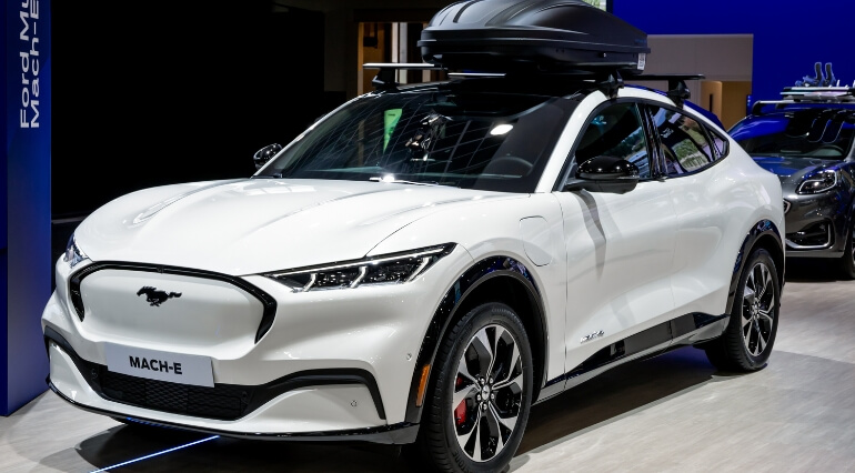 Ford Mustang Mach-E in white at a motor show