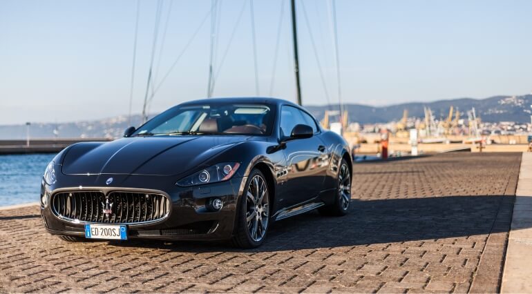 Maeserati Granturismo next to the sea
