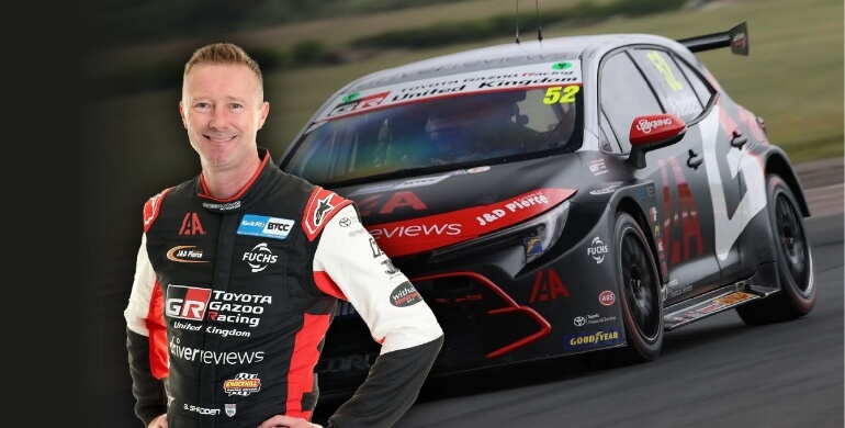 Gordon Shedden next to his Toyota touring car.