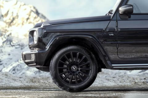 Side view of black vehicle with Vredestein tyres