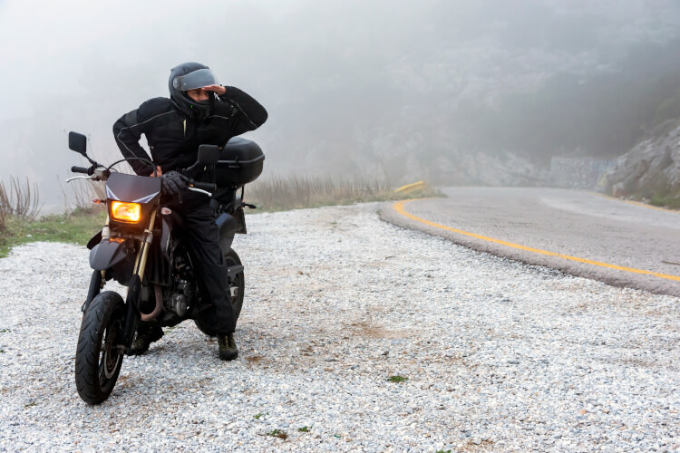 Motorbike rider stopped in the snow