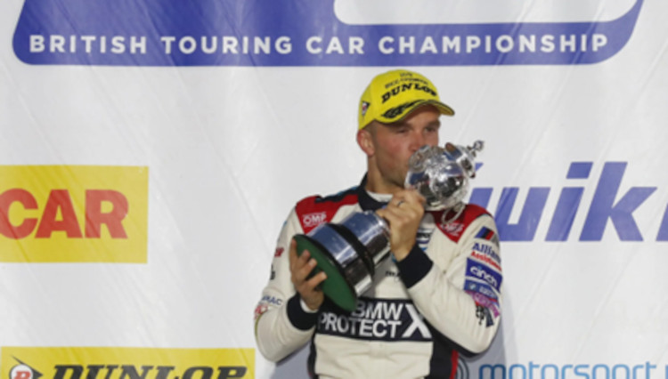 Colin Tuckington posing with a trophy win