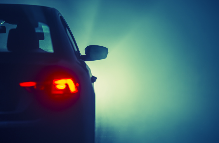 Fog lights on during a foggy evening