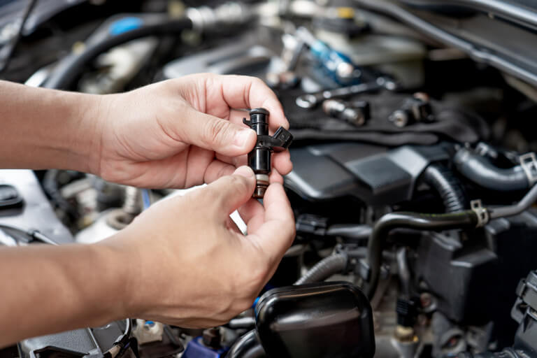Fuel Injector Being Inspected
