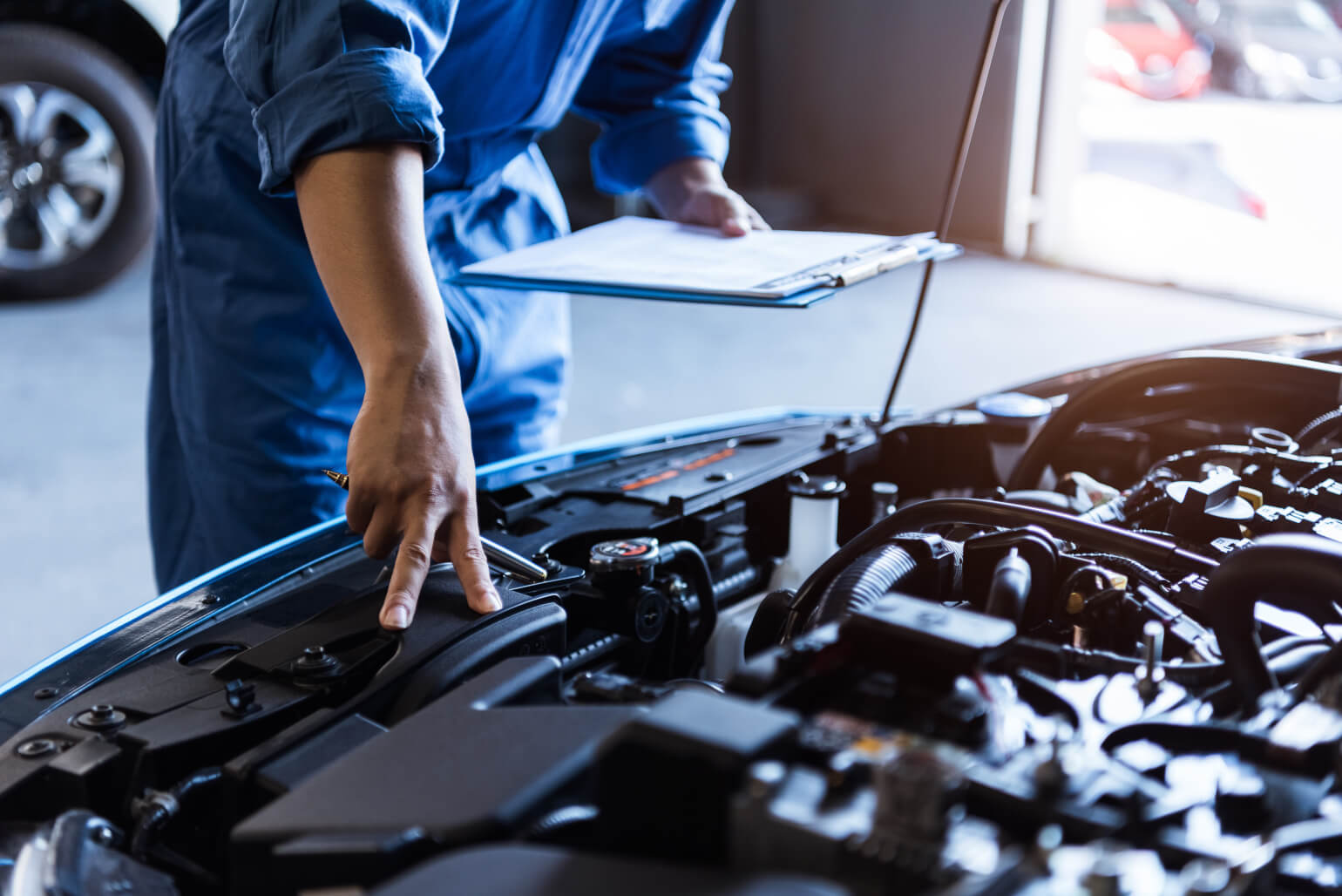 Mechanic checking car