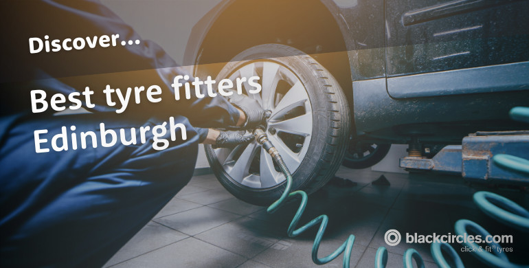 Small crossover car getting a tyre changed