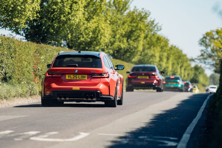 BMW M3 Tourings driving down a British b road