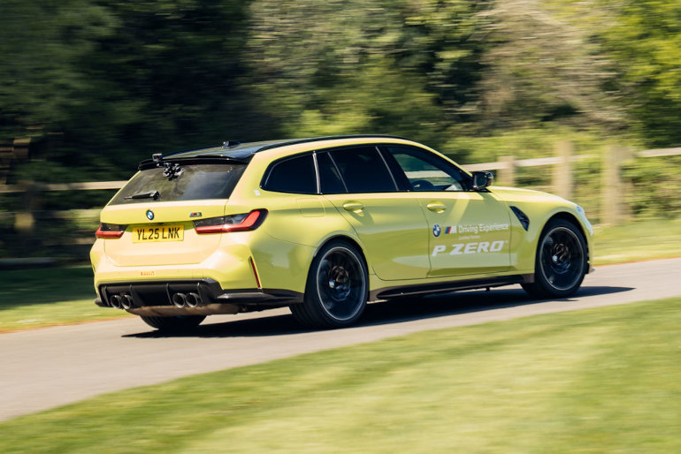 BMW M3Touring driving up Goodwood hillclimb