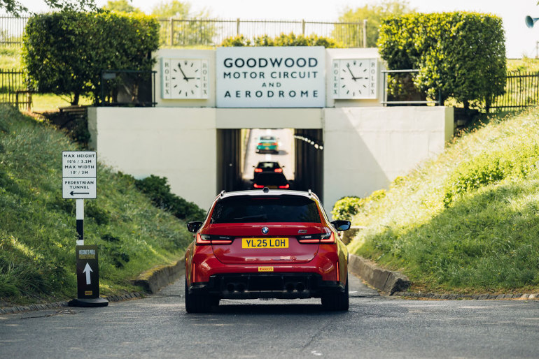 BMW M3 touring driving under Goodwood's famous arch