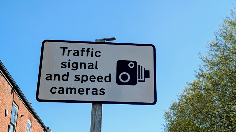 Safety camera warning sign
